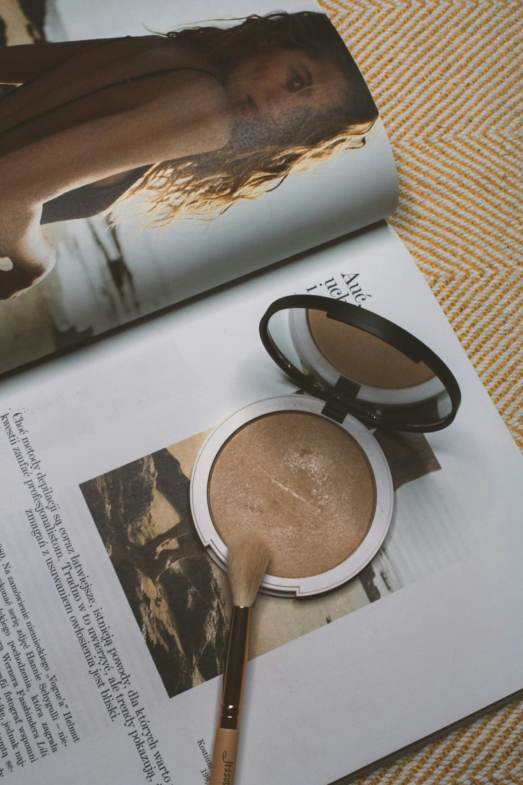 highlighter makeup compact and brush on magazine page minimal everyday makeup products